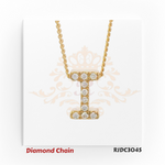 Classic yellow gold diamond chain with a pendant shaped like the letter "I", encrusted with shimmering round-cut diamonds. The pendant is attached to a twisted rope-style gold chain, presented on a white background with a regal crown and floral design. Model number RJDC3045 is shown at the bottom.