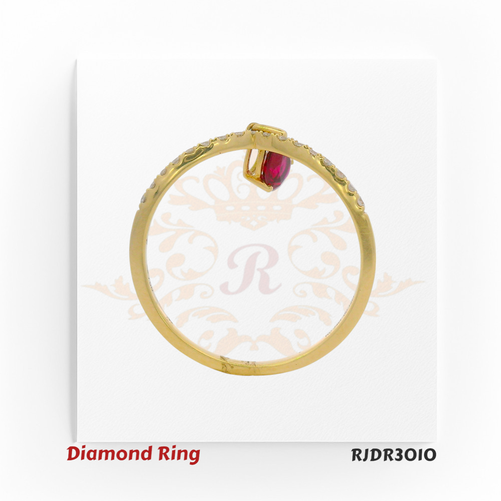 Elegant 18kt yellow gold ring featuring a V-shaped diamond band accented with a dangling pear-cut ruby – RJDR3010.