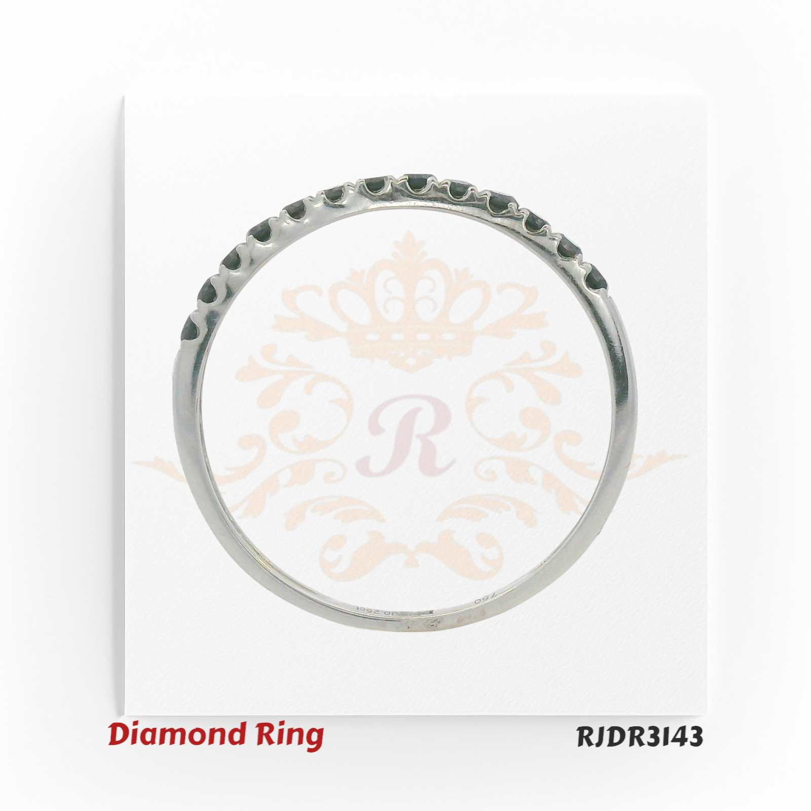 Elegant and modern, this 18kt white gold eternity ring features a continuous line of shimmering round black diamonds – RJDR3143.