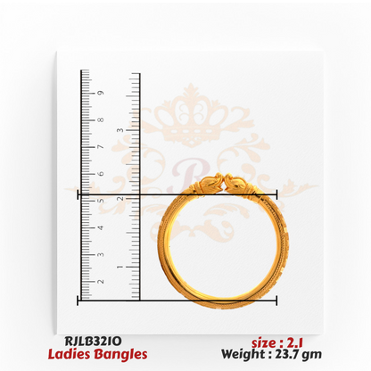 Top view of a gold ladies bangle featuring twin peacock head motifs at the clasp and intricate engraved detailing along the band, shown with a ruler for precise measurement. Model RJLB3210.
