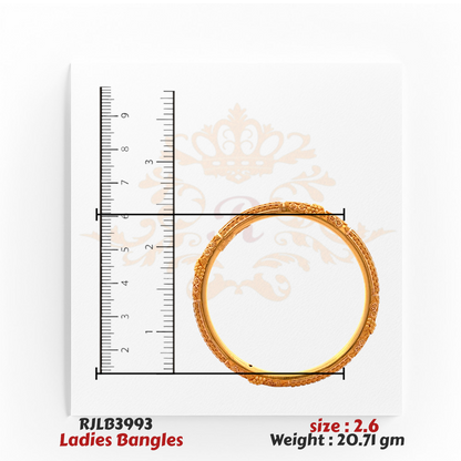Top view of an ornate gold ladies bangle adorned with intricate floral and beaded detailing along the band, displayed with a ruler for size accuracy. Model RJLB3993.