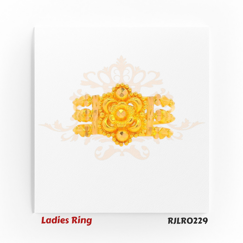 Gold statement ring with a broad band, featuring a detailed central flower, layered petal patterns, and intricate golden beading for a rich traditional look. Model RJLR0229.