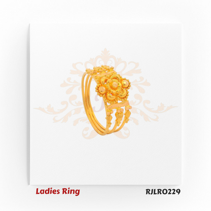 Wide gold ladies ring showcasing a central floral motif encircled by petal designs and accented with fine golden beadwork, exuding timeless regal elegance. Model RJLR0229.
