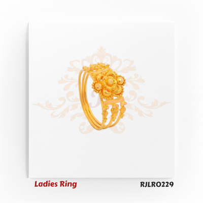 Wide gold ladies ring showcasing a central floral motif encircled by petal designs and accented with fine golden beadwork, exuding timeless regal elegance. Model RJLR0229.