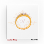 Side profile view of a contemporary ladies gold ring showing the raised baguette stone setting and contrasting rhodium strip along the shank. Model RJLR1430.