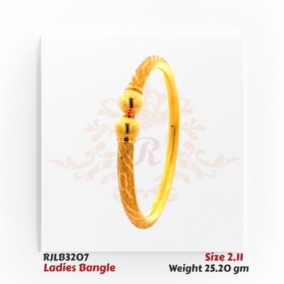 Angled view of a gold ladies bangle featuring a textured band with geometric engravings, accented at the center by two polished spherical beads for a refined and traditional style. Model RJLB3207.