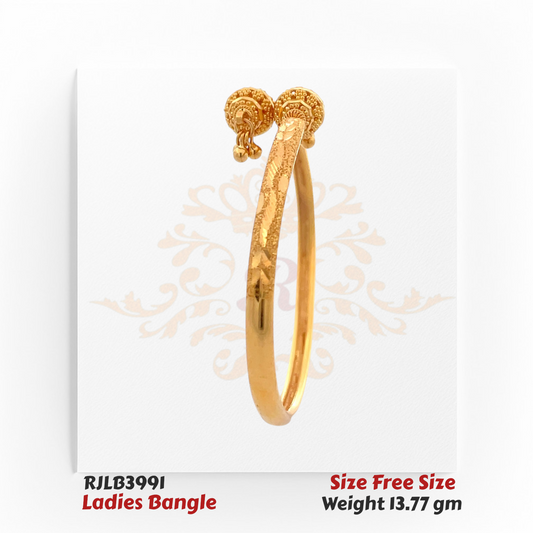 Side profile view of a textured gold ladies bangle accented with an intricate knot centerpiece and small dangling gold balls, blending elegance with traditional artistry. Model RJLB3991.