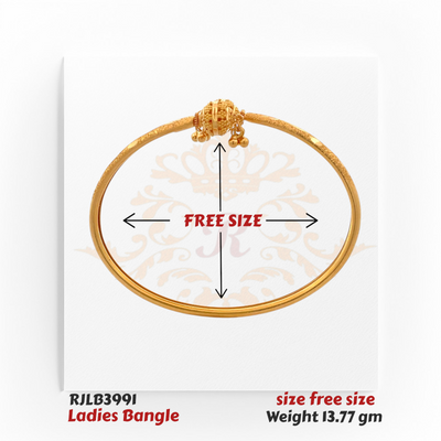 Elegant gold ladies bangle featuring a textured band and an ornate central knot design adorned with delicate bead accents and small dangling gold balls for a traditional charm. Model RJLB3991