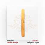 Front view of a gold ladies bangle with a central row of finely faceted gold segments bordered by white-edged detailing, offering a sleek and contemporary design. Model RJLB3994.