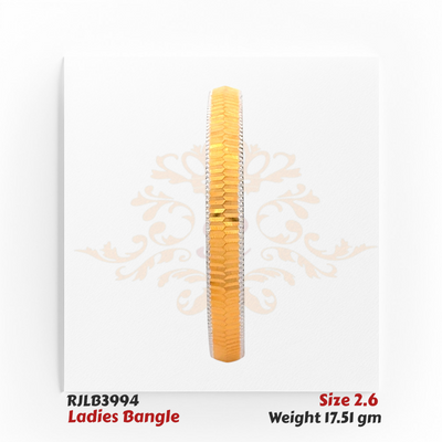 Front view of a gold ladies bangle with a central row of finely faceted gold segments bordered by white-edged detailing, offering a sleek and contemporary design. Model RJLB3994.