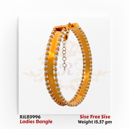 Angled view of a polished gold ladies bangle featuring dual rows of alternating white and gold beaded accents along the edges, secured with a clasp and safety chain for added elegance. Model RJLB3996.
