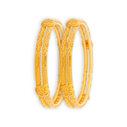 22kt Gold Ladies Bangles RJLB3938 – elegant pair of traditional kada bangles with embossed floral motifs, antique-inspired engraved detailing, angled pair view – Regal Jewels Chicago