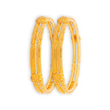 22kt Gold Ladies Bangles RJLB3938 – elegant pair of traditional kada bangles with embossed floral motifs, antique-inspired engraved detailing, angled pair view – Regal Jewels Chicago