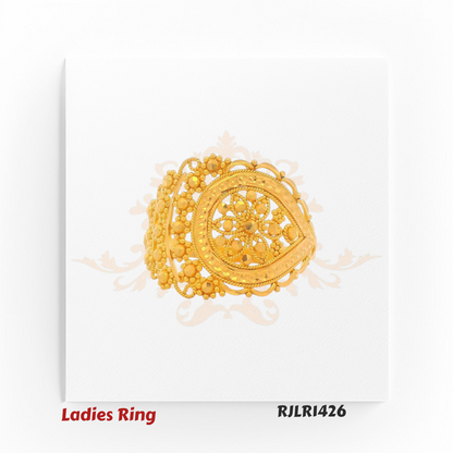 Angled view of an ornate gold ladies ring with a teardrop-shaped centerpiece, showcasing intricate floral filigree work and delicate beaded accents along the border. Model RJLR1426.