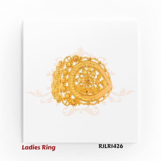 Angled view of an ornate gold ladies ring with a teardrop-shaped centerpiece, showcasing intricate floral filigree work and delicate beaded accents along the border. Model RJLR1426.