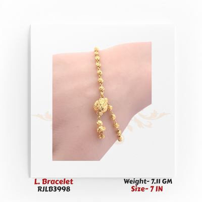 Close-up view of a traditional gold ladies bracelet featuring a linked chain of small spherical gold beads with an ornate central bead charm and two dangling gold accents, crafted in a 7-inch size. Model RJLB3998.