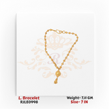 Traditional gold ladies bracelet featuring a continuous chain of small spherical gold beads with an ornate central bead charm and a dangling gold accent, crafted in an 7-inch size. Model RJLB3998.