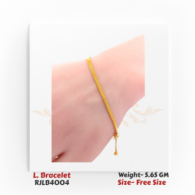 Simple and refined yellow gold ladies’ bracelet featuring a smooth mesh-like chain and a small dangling bead at the clasp. RJLB4004