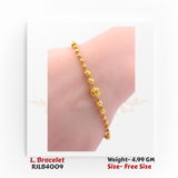 Minimalist ladies’ bracelet composed of smooth and textured yellow gold beads, with a larger ornate bead centerpiece. RJLB4009