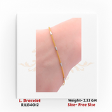 Minimalist ladies’ bracelet in yellow gold with slim chain links and subtle silver-toned rectangular accents spaced along the band. RJLB4012