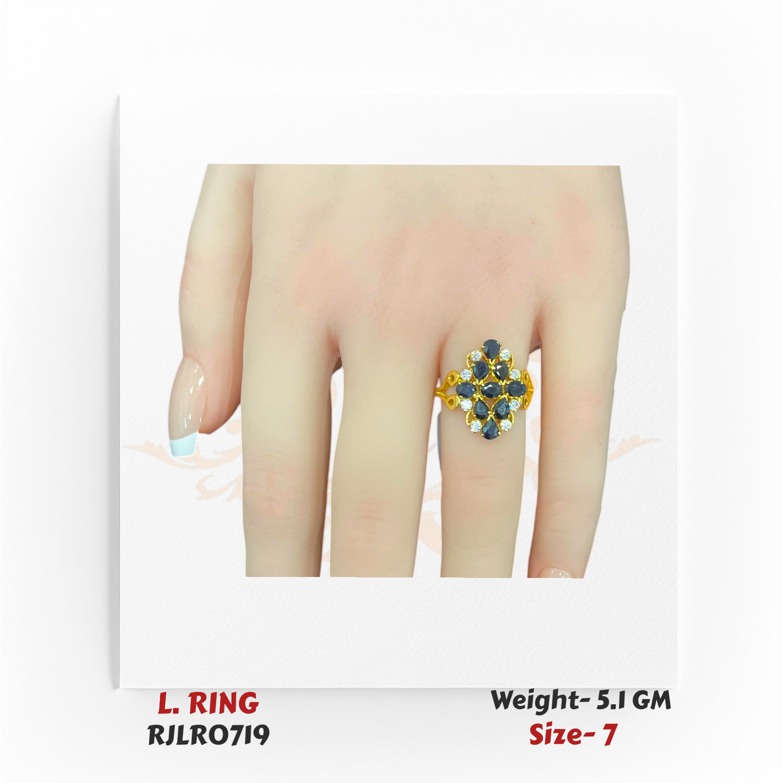 22k yellow gold ladies ring with a floral cluster of deep blue stones accented by white gems, displayed on a hand. Model RJLR0719