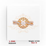 Gold ladies ring featuring a lustrous central pearl framed by a circular halo of diamonds, with a double row stone-studded band. Model RJLR1449.