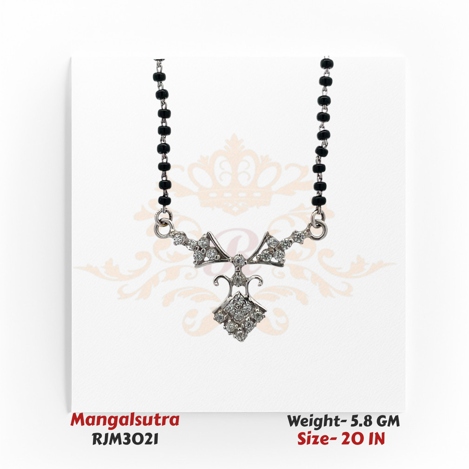 Close-up view of a modern mangalsutra featuring a sleek white gold-toned pendant adorned with sparkling stones in an intricate bow and diamond-shaped design. The pendant is attached to a traditional black-beaded chain, blending contemporary elegance with cultural tradition. Model RJM3021.