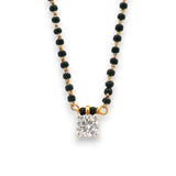 Close-up of single diamond pendant on black beaded gold chain – RJM3148A by Regal Jewels