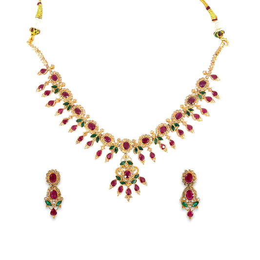 22kt Gold Bridal Necklace Set RJOMS3039 featuring a floral gemstone design with ruby and emerald settings, teardrop detailing, and a matching pair of elegant drop earrings – a luxurious handcrafted bridal jewelry piece from Regal Jewels Chicago.