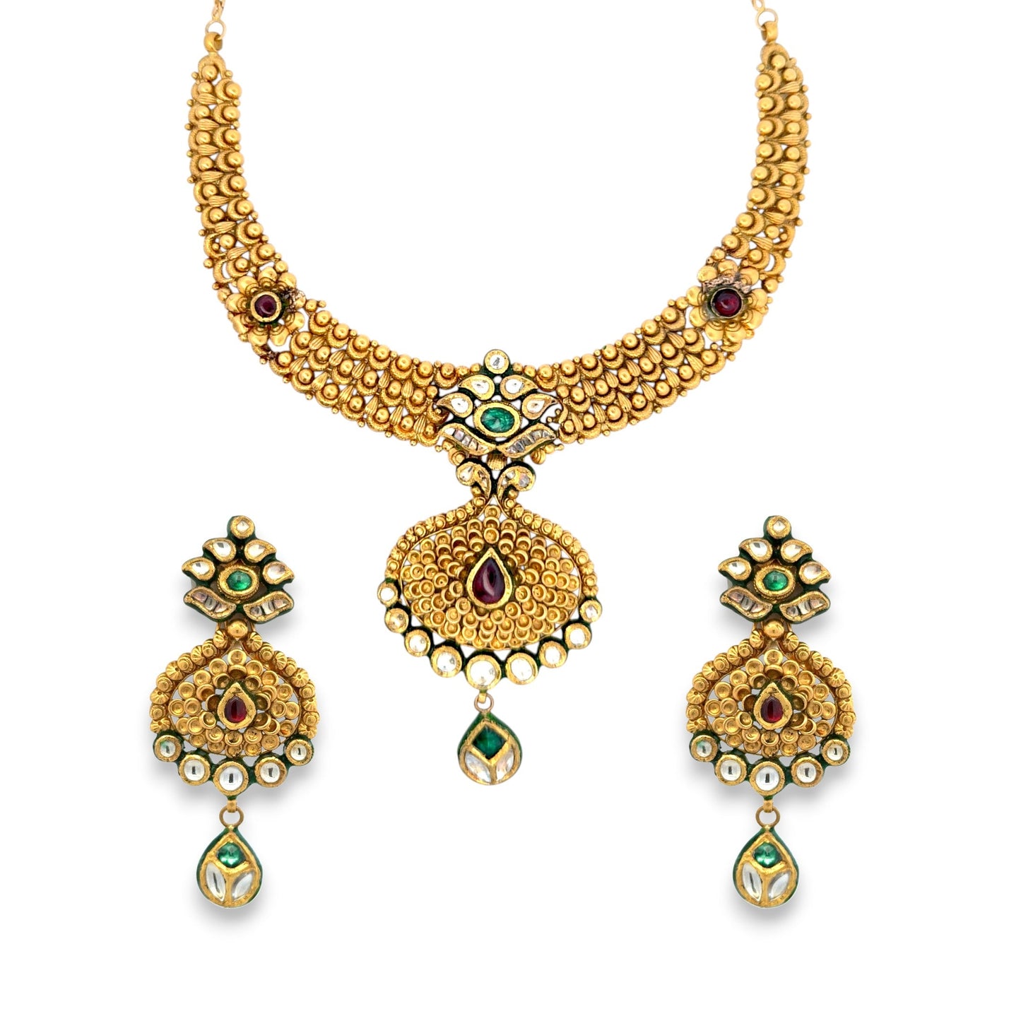 Luxurious 22kt gold antique necklace set featuring intricate Kundan craftsmanship with ruby and emerald stones, circular pendant, and matching earrings. Ideal for bridal, festive, and royal occasions from Regal Jewels Chicago.