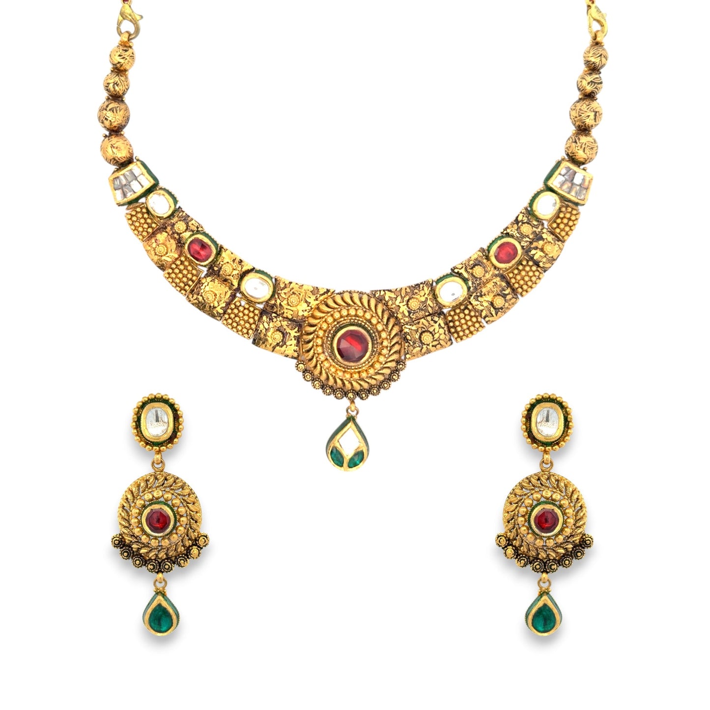 Traditional 22kt gold antique necklace set showcasing intricate Kundan craftsmanship with red and green gemstones, ornate gold patterns, and matching earrings. Perfect for bridal, festive, and traditional wear from Regal Jewels Chicago.