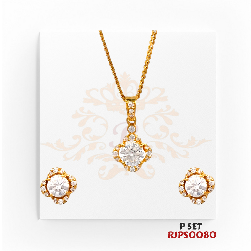 Regal Jewels (SKU: RJPS0080)Radiate elegance with this dazzling gold-plated pendant and earring set. Featuring brilliant round-cut stones surrounded by delicate accents, this timeless design adds a touch of sophistication and sparkle to any outfit. Perfect for both everyday wear and special occasions!