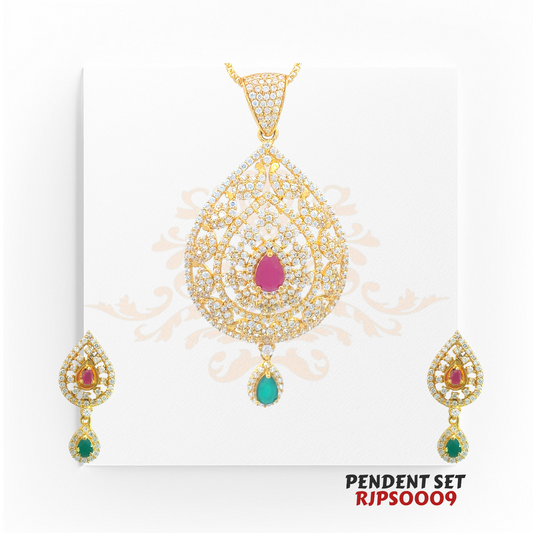 2kt Gold Ruby & Emerald CZ Pendant Set RJPS0009 – A 22.90-gram gold pendant set featuring a teardrop design, pear-cut ruby, emerald drop, and CZ embellishments. Available at Regal Jewels.