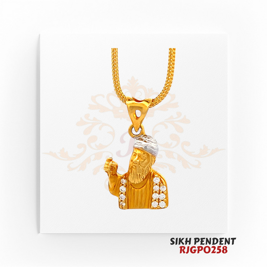 22kt Gold Sikh Pendant RJGPO258 – A finely crafted 22kt gold pendant featuring Guru Nanak Dev Ji with a rhodium-polished turban and sparkling white stones on the robe. Weighs 2.70 grams, measuring 0.50 inches in length and width. A devotional jewelry piece perfect for Sikh believers, available at Regal Jewels.