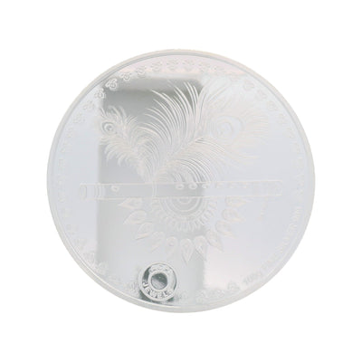 Regal Jewels RJSB0009A 100g fine silver coin engraved with Lord Krishna’s flute and peacock feather design, symbolizing divinity and harmony – a devotional collectible ideal for puja, gifting, and silver investments