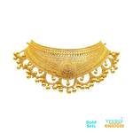 The Gold Set RJGS2033 is a beautiful handmade choker set crafted from 22kt yellow gold. It features a choker necklace without a tikka, designed in a traditional Indian style with exquisite detailing. Weight: 91.80gm 