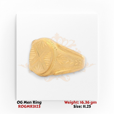 Men’s gold ring angle view highlighting heavy gold structure and carved oval design