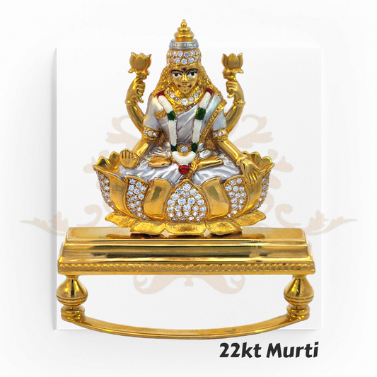 22kt Gold Laxmi Murti – A 41.4-gram idol of Goddess Laxmi seated on a lotus, adorned with fine gold detailing & gemstones. Available at Regal Jewels.