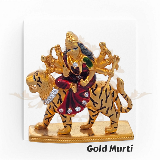 22kt Gold Durga Mata Murti – A 19.9-gram idol of Goddess Durga riding a tiger, featuring fine gold detailing & vibrant enamel. Available at Regal Jewels.