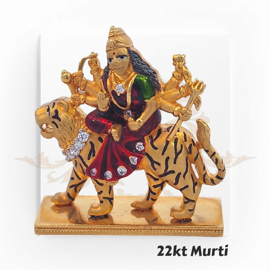 22kt Gold Durga Murti – A finely crafted 18.6-gram, 5.0 cm x 2.5 cm gold idol of Goddess Durga seated on a tiger, featuring vibrant red and green enamel detailing, available at Regal Jewels with an exclusive 3% discount when paid via Zelle.