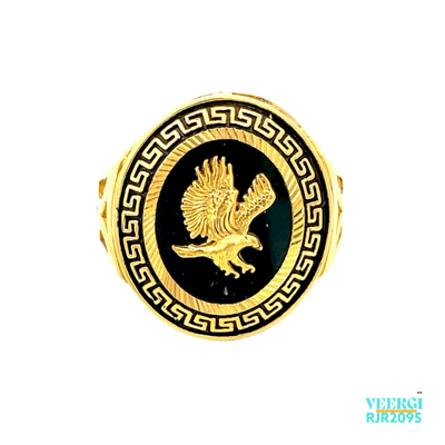 A 22kt gold men's ring with an oval top, featuring a Greek design in yellow gold and a black enamel background, with a 3D flying baaz in the middle and a black enamel background, is a striking and unique piece of jewelry. Weight: 9.70 gm Size: 10.25