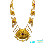 A 22kt gold traditional Punjabi Peepli Pata set with a red stone in the middle of the pendant and hanging pearls is cherished piece of jewelry. 153.3 gm